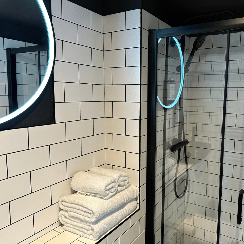 Black and white bathroom with vanity light